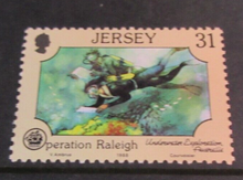 Load image into Gallery viewer, 1988 JERSEY OPERATION RALEIGH DECIMAL STAMPS X 4 MNH IN STAMP HOLDER