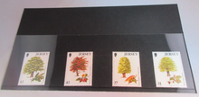 Load image into Gallery viewer, QUEEN ELIZABETH II TREES JERSEY DECIMAL STAMPS X 4 MNH IN STAMP HOLDER