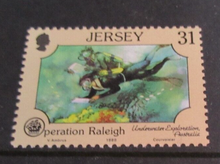 Load image into Gallery viewer, 1988 JERSEY OPERATION RALEIGH DECIMAL STAMPS X 4 MNH IN STAMP HOLDER