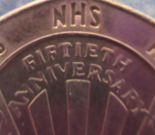 Load image into Gallery viewer, 1998 NHS 50TH ANNIVERSARY FIFTY PENCE 50P COIN IN PROTECTIVE CLEAR FLIP
