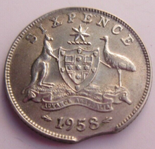 Load image into Gallery viewer, 1958 QEII CURVED CLIPPED PLANCHET ERROR 6d SIXPENCE COIN IN CLEAR FLIP
