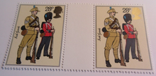 Load image into Gallery viewer, 1983 BRITISH ARMY UNIFORMS GUTTER PAIRS 8 STAMPS MNH IN CLEAR FRONTED HOLDER
