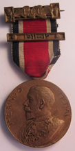 Load image into Gallery viewer, 1911-1912 THE KINGS MEDAL FOR LCC ATTENDANCE GOOD CONDUCT &amp; INDUSTRY WITH RIBBON
