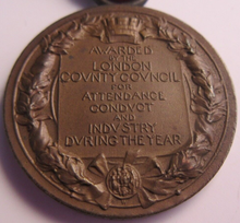 Load image into Gallery viewer, 1913-1914 THE KINGS MEDAL FOR LCC ATTENDANCE GOOD CONDUCT &amp; INDUSTRY WITH RIBBON
