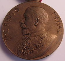 Load image into Gallery viewer, 1911-1912 THE KINGS MEDAL FOR LCC ATTENDANCE GOOD CONDUCT &amp; INDUSTRY WITH RIBBON
