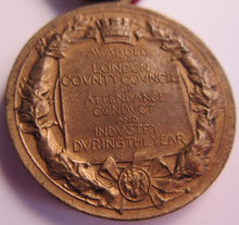 Load image into Gallery viewer, 1911-1912 THE KINGS MEDAL FOR LCC ATTENDANCE GOOD CONDUCT &amp; INDUSTRY WITH RIBBON
