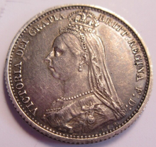 Load image into Gallery viewer, 1887 VICTORIA JUBILEE HEAD SHIELD IN GARTER 6d SIXPENCE COIN VF-EF IN CLEAR FLIP
