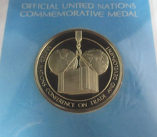 Load image into Gallery viewer, 1976 Economic Cooperation Crisis First Edition United Nations Silver Proof Medal
