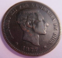 Load image into Gallery viewer, 1877 SPAIN ALFONSO XII CINCO CENTIMOS COIN IN PROTECTIVE CLEAR FLIP
