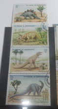 Load image into Gallery viewer, Dinosaurs 4 x Stamps + Postcard T- Rex, Stegosaurus + More S. Tome E Principe
