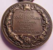 Load image into Gallery viewer, 1912-1913 THE KINGS MEDAL FOR LCC ATTENDANCE GOOD CONDUCT &amp; INDUSTRY WITH RIBBON
