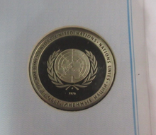 Load image into Gallery viewer, 1976 Economic Cooperation Crisis First Edition United Nations Silver Proof Medal
