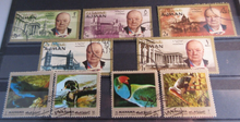 Load image into Gallery viewer, WORLD STAMPS AJMAN UNITED ARAB EMIRATES  X 19 MH IN STAMP HOLDER
