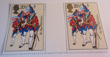 Load image into Gallery viewer, 1983 BRITISH ARMY UNIFORMS GUTTER PAIRS 8 STAMPS MNH IN CLEAR FRONTED HOLDER
