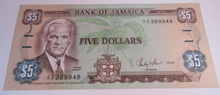 Load image into Gallery viewer, FIVE DOLLAR BANKNOTE $5 1987 BANK OF JAMAICA AS389948 GEM UNC WITH NOTE HOLDER

