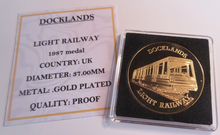 Load image into Gallery viewer, 1987 DOCKLANDS LIGHT RAILWAY GOLD PLATED PROOF MEDAL CAPSULE &amp; COA
