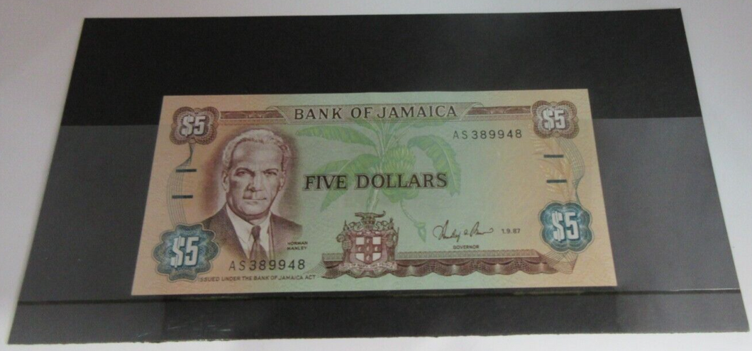 FIVE DOLLAR BANKNOTE $5 1987 BANK OF JAMAICA AS389948 GEM UNC WITH NOTE HOLDER