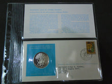 Load image into Gallery viewer, 1975 - 77 UNITED NATIONS OFFICIAL SILVER PROOF MEDAL COVER WITH STAMPS IN SLEAVE
