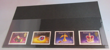 Load image into Gallery viewer, QEII 50TH ANNIVERSARY CORONATION 4 X JERSEY DECIMAL STAMPS MNH IN STAMP HOLDER
