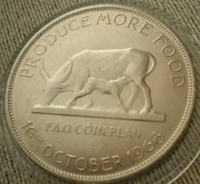 Load image into Gallery viewer, 1968 PRODUCE MORE FOOD BANK OF UGANDA FIVE SHILLING COIN IN CLEAR CAPSULE
