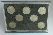 Load image into Gallery viewer, FLORIN SET OF SEVEN SILVER COINS IN CLEAR HARD CASE &amp; ROYAL MINT BLUE BOOK
