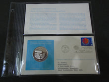 Load image into Gallery viewer, 1975 - 77 UNITED NATIONS OFFICIAL SILVER PROOF MEDAL COVER WITH STAMPS IN SLEAVE
