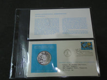 Load image into Gallery viewer, 1975 - 77 UNITED NATIONS OFFICIAL SILVER PROOF MEDAL COVER WITH STAMPS IN SLEAVE
