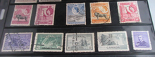 Load image into Gallery viewer, 1940&#39;s &amp; 1950&#39;s COMMONWEALTH STAMPS FINE USED WITH CLEAR FRONTED STAMP HOLDER
