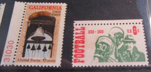 Load image into Gallery viewer, 1960&#39;S USA 7 X STAMPS MNH IN A CLEAR FRONTED STAMP HOLDER

