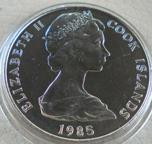 Load image into Gallery viewer, 1985 QUEEN ELIZABETH II COOK ISLANDS ONE DOLLAR COIN PRESENTED IN CLEAR CAPSULE
