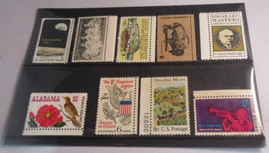CIRCA 1960'S USA 9 X STAMPS MNH IN A CLEAR FRONTED STAMP HOLDER