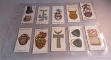 Load image into Gallery viewer, WILLS CIGARETTE CARDS LUCKY CHARMS COMPLETE SET OF 50 IN CLEAR PLASTIC PAGES
