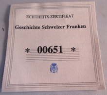 Load image into Gallery viewer, 2008 HISTORY OF THE SWISS FRANC SILVER PLATED 35MM MEDAL INSET 5 FRANC CAP &amp; COA
