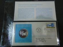 Load image into Gallery viewer, 1975 - 77 UNITED NATIONS OFFICIAL SILVER PROOF MEDAL COVER WITH STAMPS IN SLEAVE
