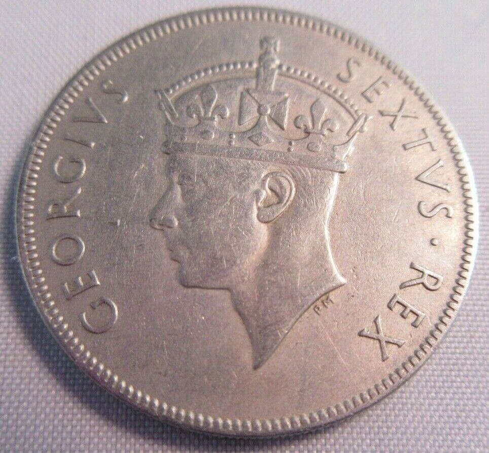 1950 KING GEORGE VI EAST AFRICA BUNC ONE SHILLING COIN & CLEAR FLIP