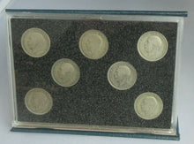 Load image into Gallery viewer, FLORIN SET OF SEVEN SILVER COINS IN CLEAR HARD CASE &amp; ROYAL MINT BLUE BOOK
