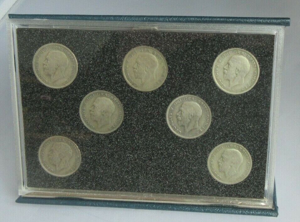 FLORIN SET OF SEVEN SILVER COINS IN CLEAR HARD CASE & ROYAL MINT BLUE BOOK