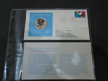 Load image into Gallery viewer, 1975 - 77 UNITED NATIONS OFFICIAL SILVER PROOF MEDAL COVER WITH STAMPS IN SLEAVE
