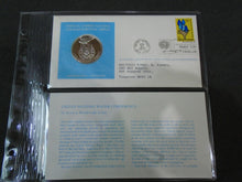 Load image into Gallery viewer, 1975 - 77 UNITED NATIONS OFFICIAL SILVER PROOF MEDAL COVER WITH STAMPS IN SLEAVE
