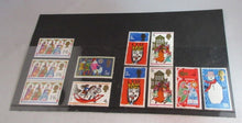 Load image into Gallery viewer, VARIOUS CHRISTMAS STAMPS X 11 MNH 1966-1969 IN CLEAR FRONTED STAMP HOLDER
