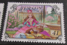 Load image into Gallery viewer, QUEEN ELIZABETH II JERSEY CHILDRENS STORIES DECIMAL STAMPS MNH IN STAMP HOLDER
