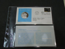 Load image into Gallery viewer, 1975 - 77 UNITED NATIONS OFFICIAL SILVER PROOF MEDAL COVER WITH STAMPS IN SLEAVE
