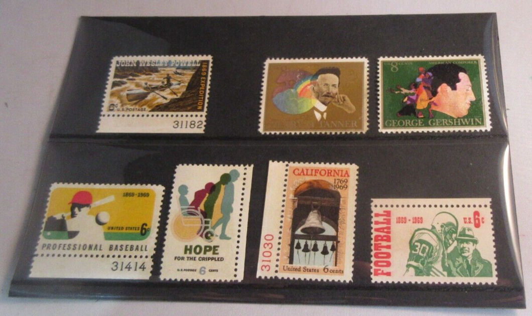 1960'S USA 7 X STAMPS MNH IN A CLEAR FRONTED STAMP HOLDER