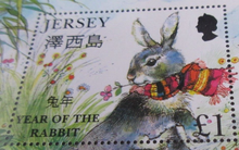 Load image into Gallery viewer, QUEEN ELIZABETH II JERSEY YEAR OF THE RABBIT MINISHEET &amp; STAMP HOLDER
