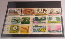 Load image into Gallery viewer, 1960&#39;S &amp; 1970&#39;S USA 12 X STAMPS MNH IN A CLEAR FRONTED STAMP HOLDER
