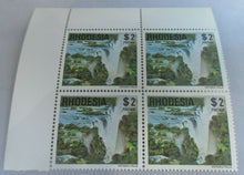 Load image into Gallery viewer, RHODESIA VICTORIA FALLS BLOCK OF 4 $2 STAMPS MNH IN CLEAR FRONTED STAMP HOLDER
