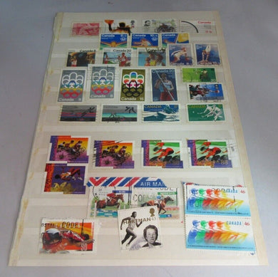 VARIOUS SPORTING CANADA & OTHERS STAMPS WITH CLEAR FRONTED HOLDER