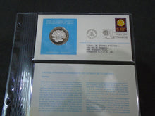 Load image into Gallery viewer, 1975 - 77 UNITED NATIONS OFFICIAL SILVER PROOF MEDAL COVER WITH STAMPS IN SLEAVE
