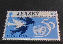 Load image into Gallery viewer, QEII JERSEY DECIMAL STAMPS 50TH ANNIVERSARY UNITED NATIONS MNH IN STAMP HOLDER
