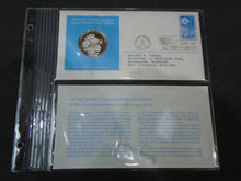 Load image into Gallery viewer, 1975 - 77 UNITED NATIONS OFFICIAL SILVER PROOF MEDAL COVER WITH STAMPS IN SLEAVE
